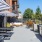 a courtyard with tables and umbrellas
