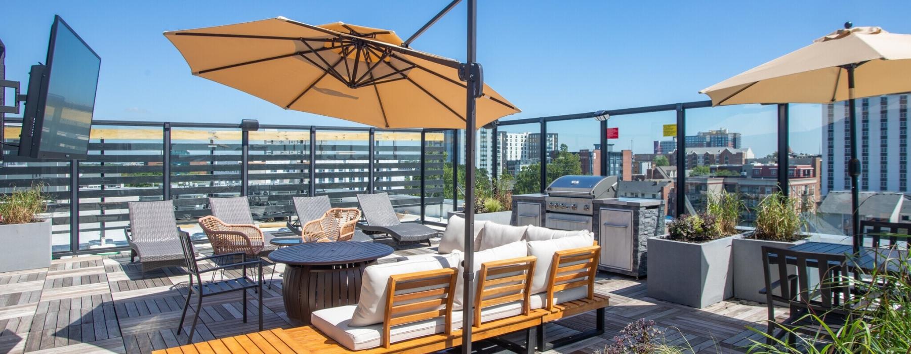 a patio with umbrellas and chairs