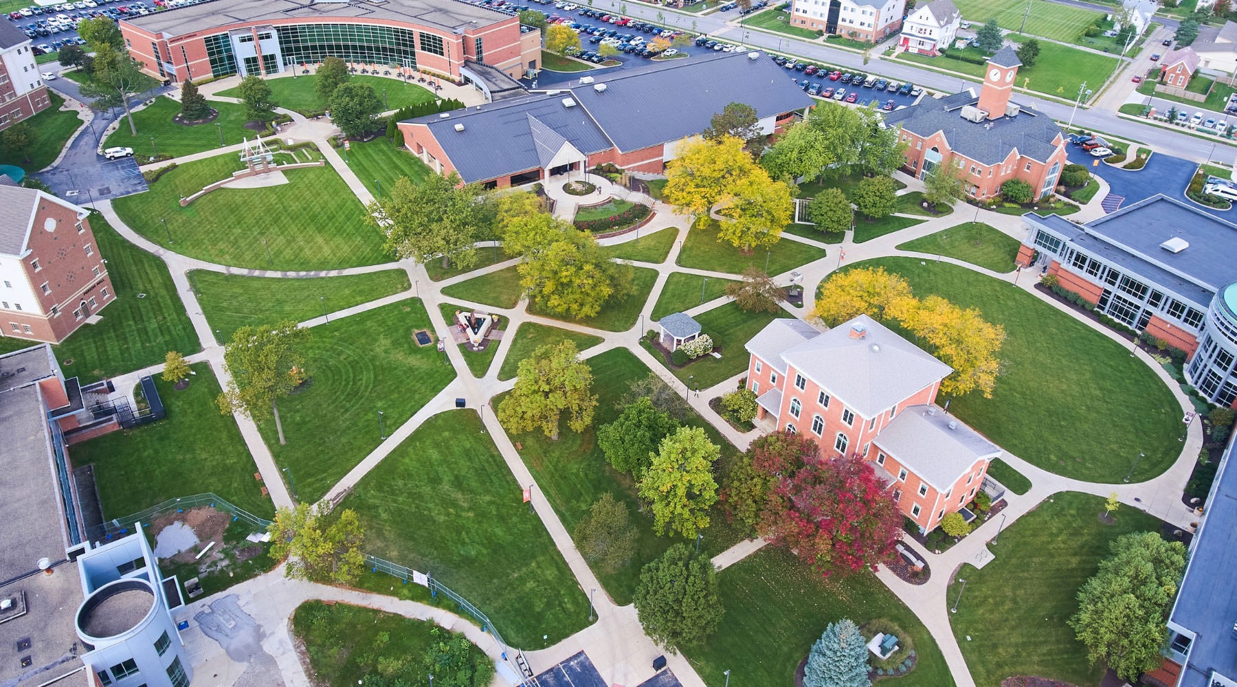 Find your perfect fit at Lancaster Apartments aerial view of a campus with a lot of green space and buildings