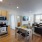 a kitchen with dining table a chairs