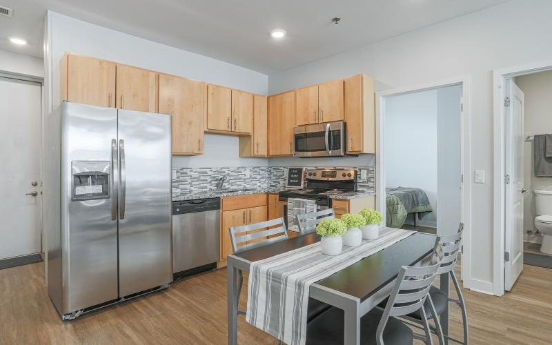 a kitchen with a table and chairs