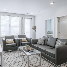 Spacious and well-lit living spaces a living room with a couch and a coffee table
